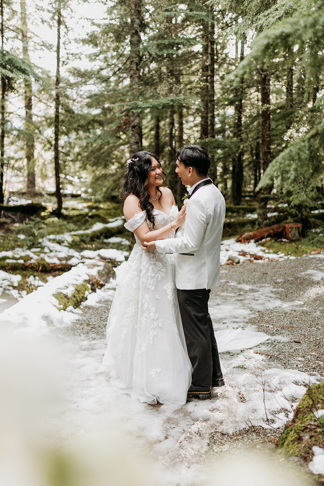 Couple portrait in a snowy winter forest in Whistler